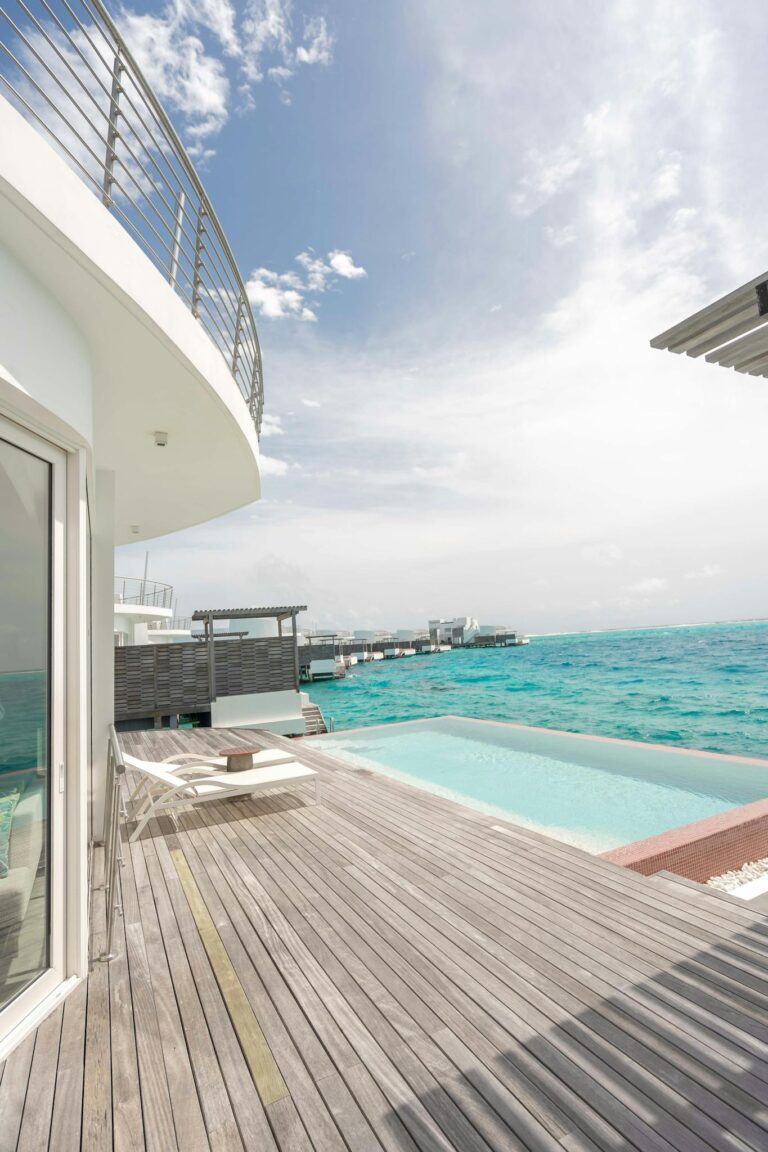 Modern beachfront villa in Maldives with stunning ocean views.